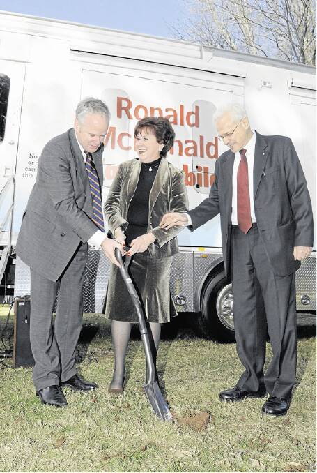 GROUNDBREAKING: Ronald McDonald House Charities CEO Malcolm Coutts, chairperson of the Orange McDonald House board Joanne Lewis and NSW chief paediatrician Professor Les White (AM) turn the first sod on the site of Orange’s Ronald McDonald House. Photo: JUDE KEOGH 0616rmh6