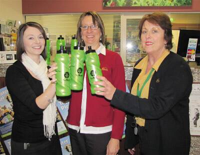 TAP IT: Cabonne Council staff members Amanda Wood, Jann Ferguson and Debra Oates help out the environment with the free re-usable water bottles that have been snapped up by local residents.