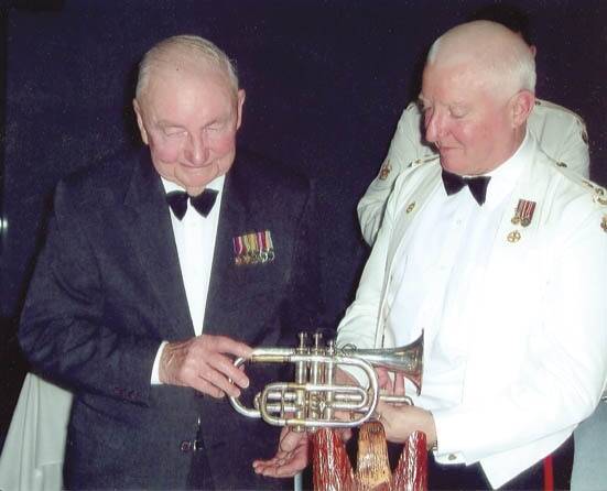 IN GOOD HANDS: Changi survivor Keith Harris of the former 2/19th Batallion hands to Lieutenant Colonel Peter Morrisey a cornet used by troops of the 2/19th Batallion on the Burma Railway. It is now housed at Romani Barracks in Orange.
