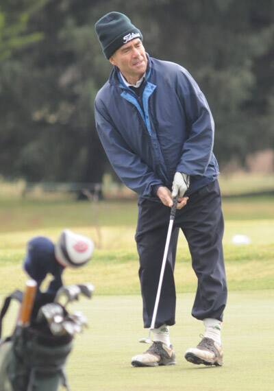 KEEPING WARM: Lee Rouse watches his putt during a round at Duntryleague.