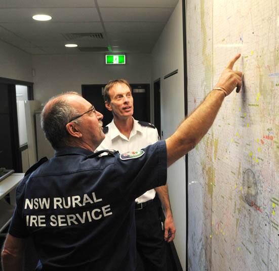 TAKE A PEAK: Canobolas NSW Rural Fire Service operations officer Steve Smith and operations officer, superintendent Brett Bowden, will open the control centre’s doors to the public today. Photo: STEVE GOSCH        0924sgrfs3