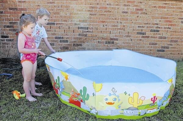 SUMMER FUN (left): Haylee and Riley Govier get ready to splash about. Photo: STEVE GOSCH 0105sgwater