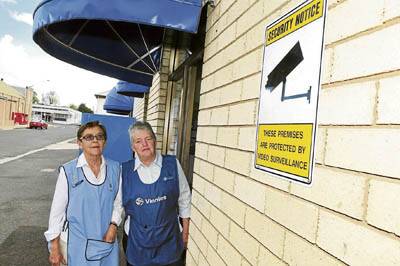 KEEPING A CLOSE EYE: Flora Allen and Ros Brander check out St Vincent de Paul Society’s new security system.