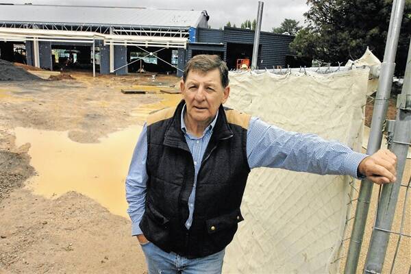 WAITING GAME: Orange City councillor Reg Kidd said councillors should have been told sooner about delays at the aquatic centre. The completion date has now been pushed back to mid-March. Photo: STEVE GOSCH                                                                                                                                           0202sgpool