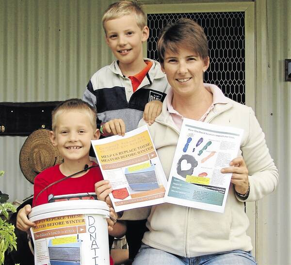 DETERMINED: Cumnock Public School students Duncan and Jack Job and their mother Pip campaign to replace the school’s unflued gas heaters before winter.