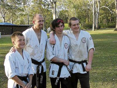 GREAT GROUP: Orange's High Impact Martial Arts members (from left) Toby Westcott, Shihan Anthony Wharton, Hayden Crawford and Charles Jones at the recent black belt grading.