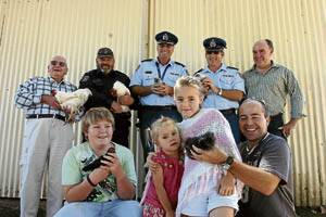 JAILBIRDS: Officials from Oberon Correctional Centre with members of Orange Poultry Club and the birds that have been donated to inmates to exhibit at shows. Back: Merve Rosser, correctional officer and Orange Poultry Club member Gary Norman, deputy governor Mark Kennedy, Oberon Correctional Centre acting general manager Richard Ayoub and Orange Show Society president Peter Naylor. Front: Braydan