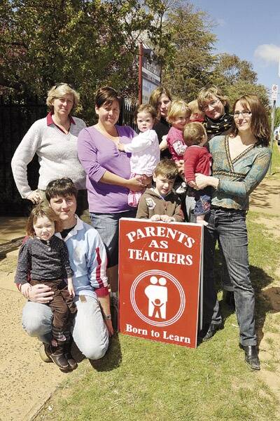 SAVE OUR SERVICE: (l-r) Timothy and Victoria Hanlon, Narelle Lewis, Kelly Birch and Emily Radnedge, Thomas, Angie and Solomon Curran, Beate and Greta Hahn and Melissa and Roxy Macdouall want the Department of Education and Training’s Parents as Teachers program to keep running in Orange.