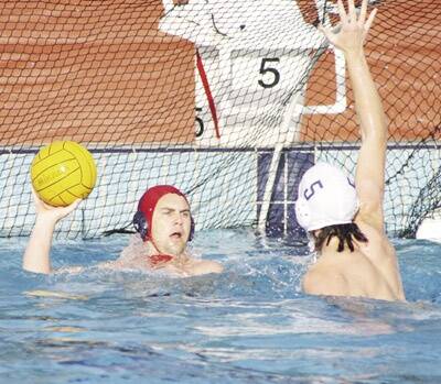 UNDER PRESSURE: Stannies’ Ryan Sanders (right) tries to block a pass from Pirates’ Andrew Morcom in their Bathurst Water Polo showdown on Tuesday night.