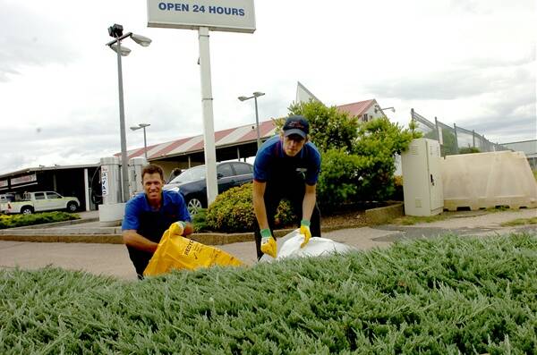 CLEANING UP: Pete's Carwash owner Pete Muller and Sam Clarke will be cleaning up the streets today.