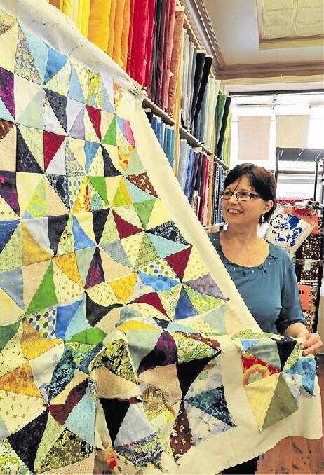 SENSE OF PRIDE: Lucy Mogilin has thrown her support behind the Aussie Hero Quilts movement, which provides quilts and laundry bags to our troops in Afghanistan. Photo: JUDE KEOGH 0317patchwork