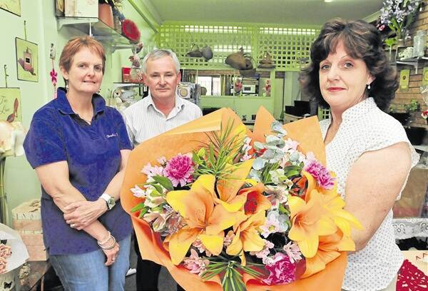 NO CONSULTATION: Florists Sally Wright, Tony Hazell and Sheryl Lewis are unhappy with a decision to ban flowers from the new Orange Health Service.Photo: JUDE KEOGH  0317noflowers1