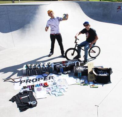 PILE OF PRIZES: Orange’s Dan Baker (left) and Will Gunn with just some of the $5000 worth of prizes up for grabs at Saturday’s Stephen Dark Memorial BMX Jam.