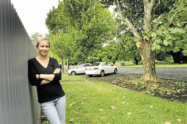 UNNECESSARY: National Avenue resident Olivia West was shocked to discover Essential Energy had pruned the plane tree to keep it away from overhead power lines despite work to underground the lines expected to start in two months.
