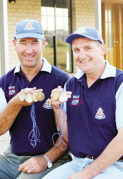 ON FIRE: Pistol shooters Dean Brus (left) and Dave Oates have ensured Orange’s dominance of he World Association 1500 national title. Photo: JUDE KEOGH