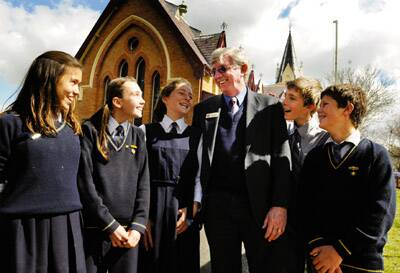 RETIREMENT PLANS: Orange Public School principal John Webb, with students Phoenix Aguila, Gemma L’Estrange, Annabel Sheehan, Hamish Sheehan and Mitchell Beasley, has announced he will retire at the end of this year.