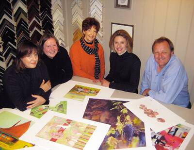 ART FOR EVERYONE: Artists Laretta Goodacre, Mary Ann Mein, Loretta Blake and Angela Naef and Art of Orange founder Malcolm Key inspect some of the prints available for sale through the new online gallery.