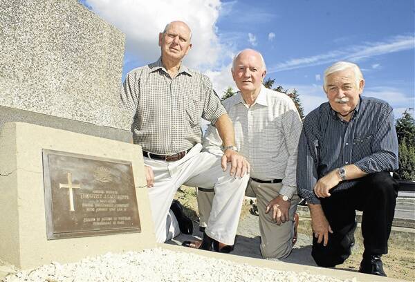 NOT FORGOTTEN: Aub Terry, Tom Young and Bob Pink visit the grave of Tim Cutcliffe this week in the lead-up to a commemoration to be held on April 22 for  the young Orange man who was killed in the Vietnam War. Photo: MARK LOGAN 0314vietnam