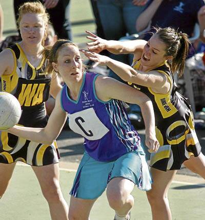 SHE'S BACK: Tegan Dray, pictured playing for Robin Hood during the 2008 Orange Netball Association division one grand final, is back after a year in London.
