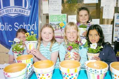 GONE POTTY: Students from Millthorpe Public School created ‘arty crafty pots’ to sell in the main street for historic Millthorpe’s garden ramble. Pictured are Katlin Lieben, Annika Benjafield, Adelaide Kovac, Claudia Kay and Rose Andree-Evarts. Photo: TRACEY JOHNS