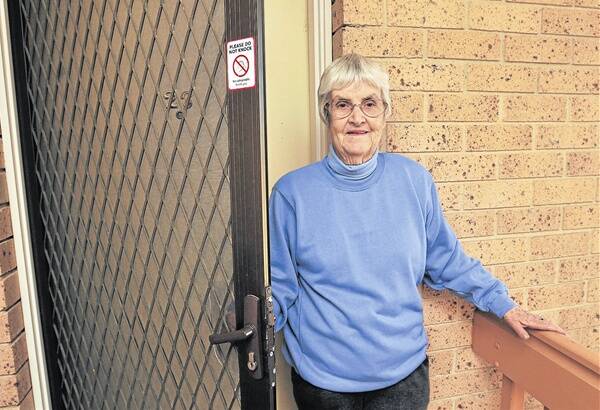 KNOCK, KNOCK: Orange resident Betty McEvoy won’t be getting disturbed by any door-to-door salespeople while her “Please, Do Not Knock” sticker is on her door. Photo: JUDE KEOGH   0905knock1