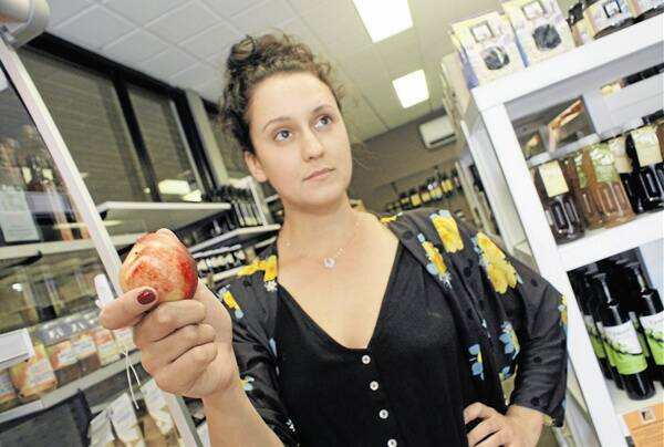 SHE’S NOT APPLES: Slice of Orange co-owner Jess Lovick said she hopes customers will continue to purchase fresh, in season produce locally during the price war. MARK LOGAN 0131mlfruit1 to 3