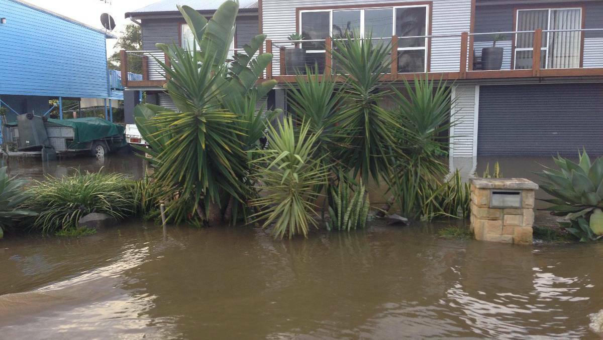 Flooding in Port Macquarie. Photos: DANE PHELPS, TIM HITCHINS