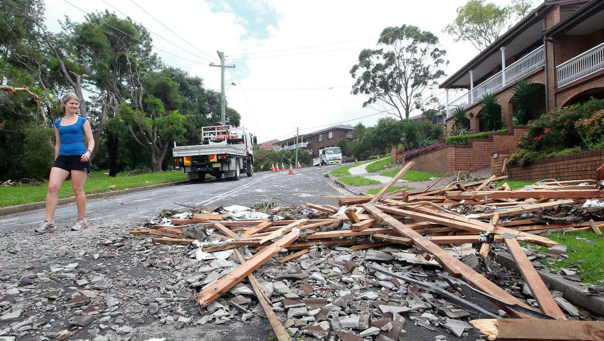 Emergency workers and residents come to grips with the scale of damage in Kiama, on the NSW South Coast. Photos: SYLVIA LIBER, DAVID TEASE