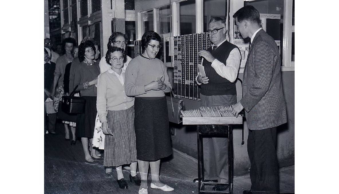 Email employees collect their holiday pay, 1962. Photo: CWD Negative Collection, Orange & District Historical Society.