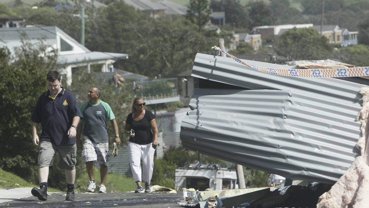 Emergency workers and residents come to grips with the scale of damage in Kiama, on the NSW South Coast. Photos: SYLVIA LIBER, DAVID TEASE