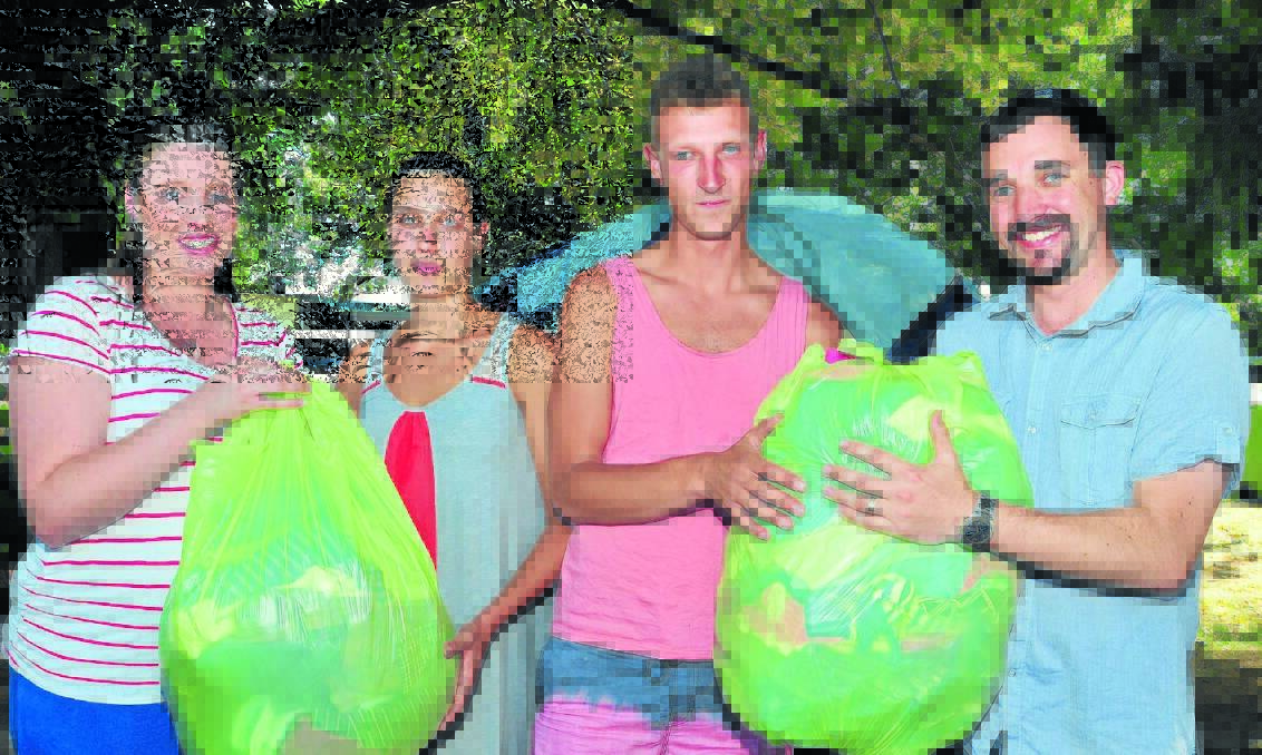 HELPING HAND: Ashley Barnes and Josh Barnes (left) donated two bags of clothes to Marie Dufour and Jonathan Mur after the group were left with nothing when their tents were burnt to the ground. 