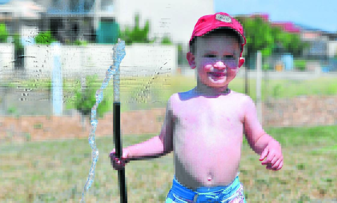 WET AND WILD: Patrick Penberthy-Neil tries his best to cool down as temperatures soared to about 33 degrees yesterday. By 5pm the temperature was still 32.1 degrees. Photo: JUDE KEOGH 1220water