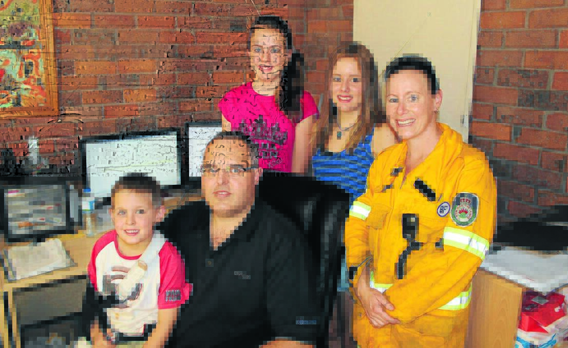 ON CALL: When Katrina Smith's pager goes off for a fire call her husband Ray Smith and children Cooper Smith, Kattie-Lee Bennett and Elizika Brain are like a well-oiled machine. Photo: LUKE SCHUYLER                            0120lssmith1