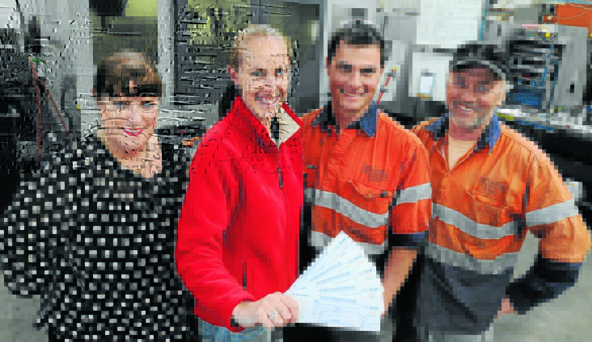ON BOARD: Orange and Cabonne road safety officer Andrea Hamilton-Vaughan congratulates Samantha Campbell, Rick Soley and Shayne Ogilvie of Scott Camery Welding for signing up to win taxi vouchers for their work Christmas party. Photo: STEVE GOSCH  1129vouchers