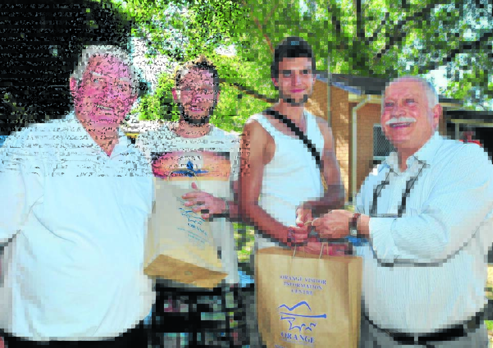 REACHING OUT: Mayor John Davis and Cr Chris Gryllis donate $500 worth of supplies to backpackers Mickael Blainville and Antoine Fournier.   Photos: LUKE SCHUYLER  0104lsbackpackers