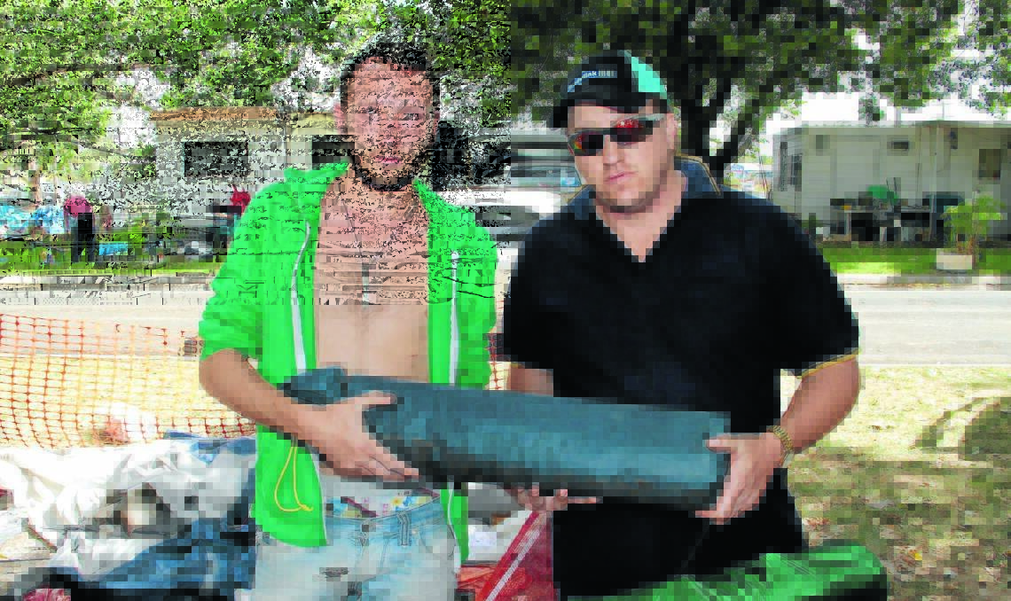 GOODWILL GESTURE: Orange resident David Jones (right), pictured with Antoine Mickael, donated three tents to the French backpackers. Photo: JACK KEMP 0102jkbackpackers6