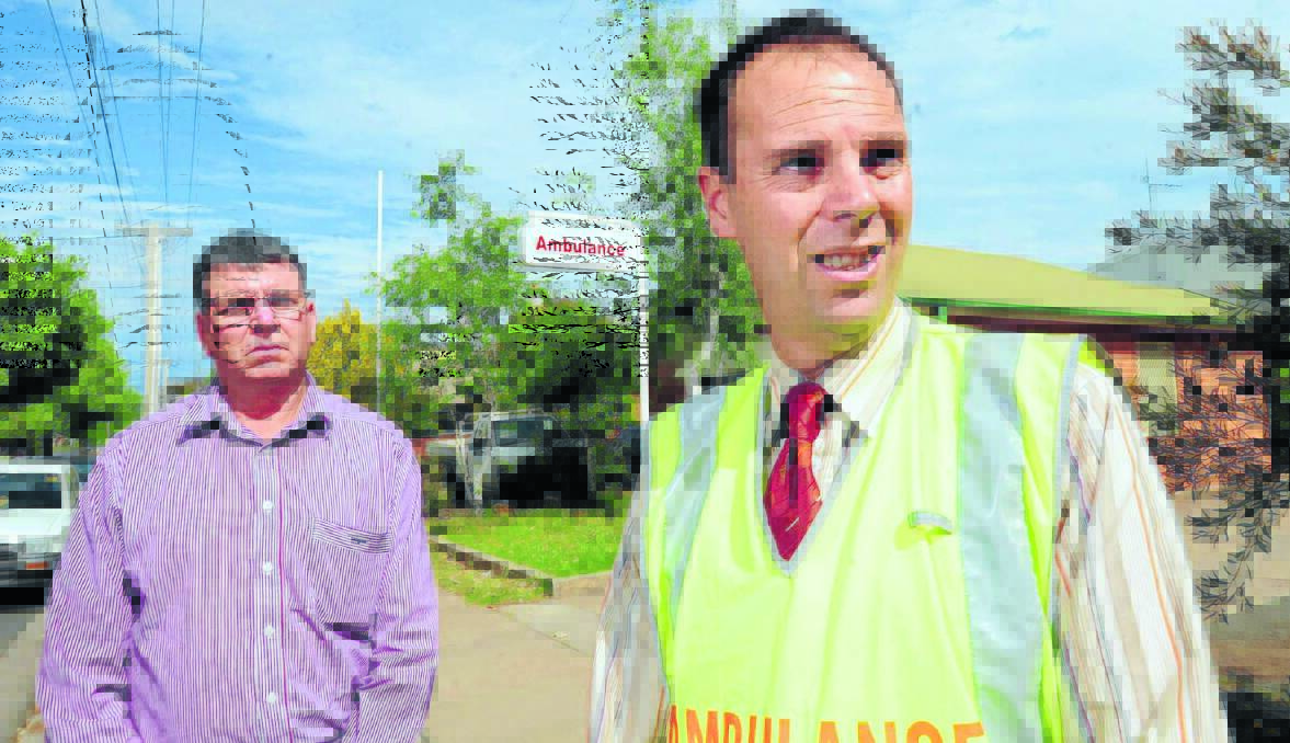PARAMEDIC CRISIS: Cr Glenn Taylor lends his support to Health Services Union representative Ian Spurway who will wear a bright vest today as part of a statewide protest for more paramedeics.  Photo: STEVE GOSCH 1108sgambos2