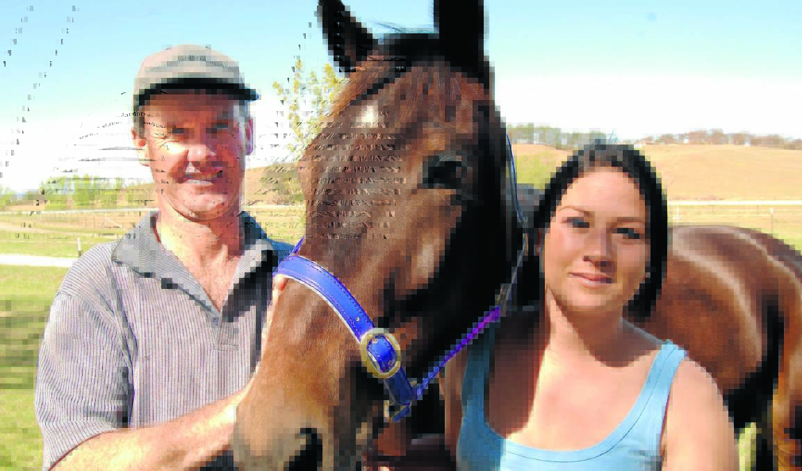 FAMILY TRADITION: Gemma Hewitt has taken up training, like her father Bernie, and will have her first horse in action at Bathurst tonight. Unfortunately Gemma won’t be there to see Fliteoftheconcords run because she is helping Bernie with a team of horses in Queensland.             Photo: ZENIO LAPKA 101909zhewitt1
