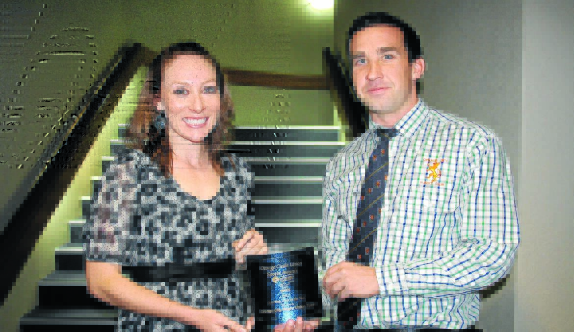 DOUBLE ACT: Tegan Dray and Michael Sparks were happy to share the spoils for the 2012 Orange Credit Union Sports Awards team of the year.              Photo: MICHELLE COOK 0805mcteams