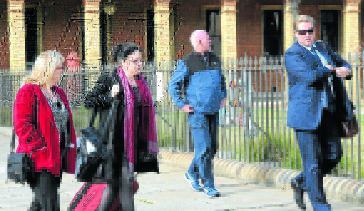 BACK TO COURT: Fiona Rossiter walks into Bathurst Court House with her barrister Sophie Walsh and instructing solicitor David King-Christopher. Photo: PHILL MURRAY 										            062713prossiter3
