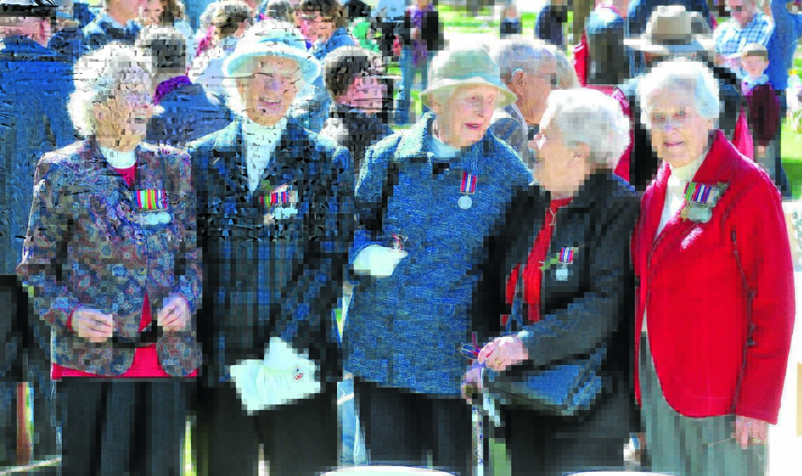 TIMES PAST: Ex-Servicewomen Dot Floyd, Jill Brough, Ruth Clarke, Gillie Street and Joan Kemp came together at yesterday's Anzac Day civic commemoration service. 							  Photo: JUDE KEOGH 0425anzac63