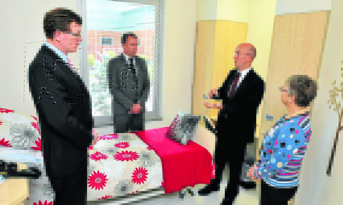 LIFE-CHANGING ROOM: Member for Orange Andrew Gee, Mental Health Minister Kevin Humphries and Western Local Health District mental health director Dr Russell Roberts and chief-executive Pim Allen in one of the eight new Involuntary Drug and Alcohol Treatment (IDAT) rooms. Photo: CLARE COLLEY 1012ccalcohol