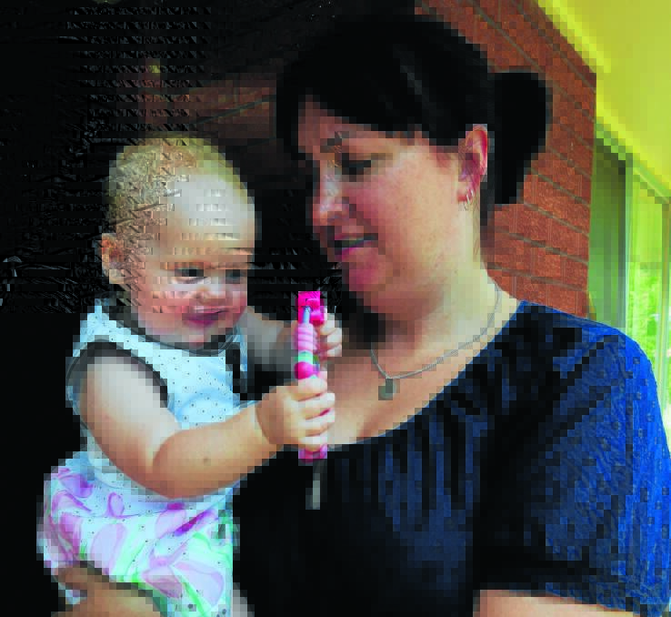TOP PICK: Rebecca Bryden with her eight-month-old daughter Lily. Photo: LUKE SCHUYLER  0101lslily3