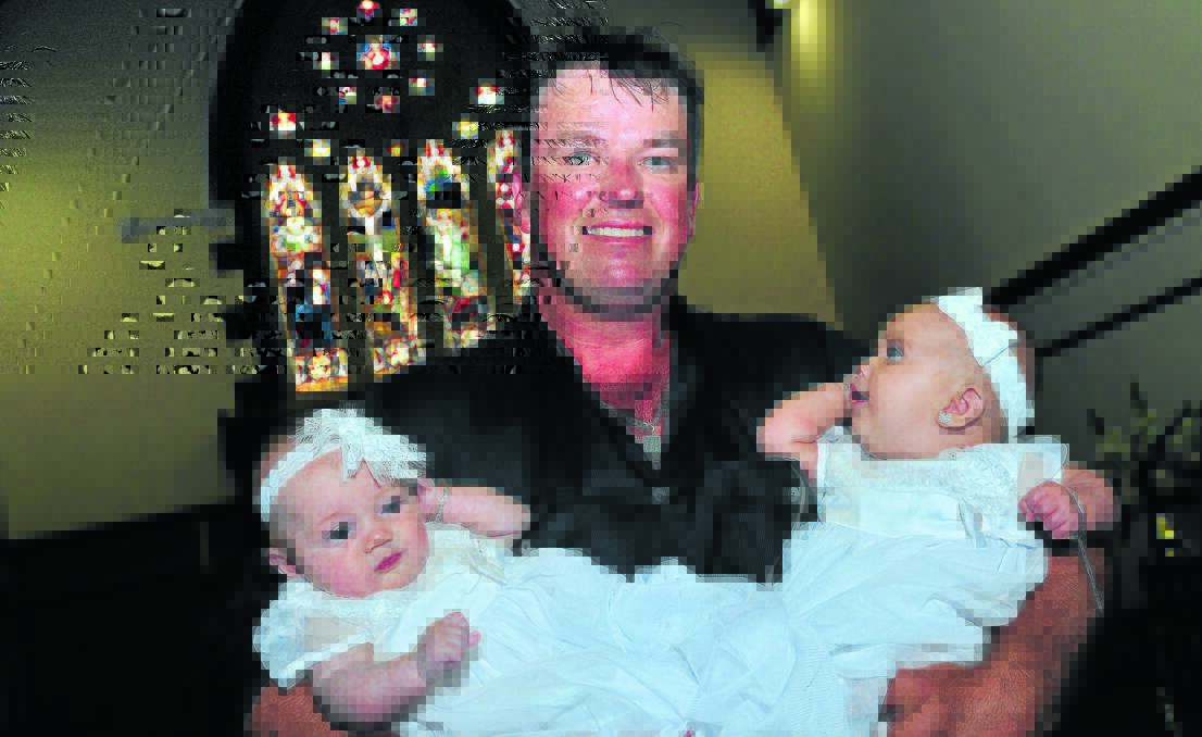 A FAMILY AFFAIR: Tom Partridge's daughter Mia, three months, (left) is the aunt of Tom's granddaughter Ariannah, four months, (right).                              Photo: MARK LOGAN