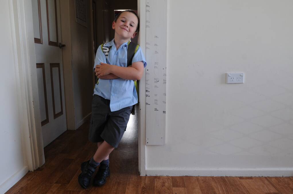 Zachary Howarth gets ready for his first day of school. Photo: STEVE GOSCH
