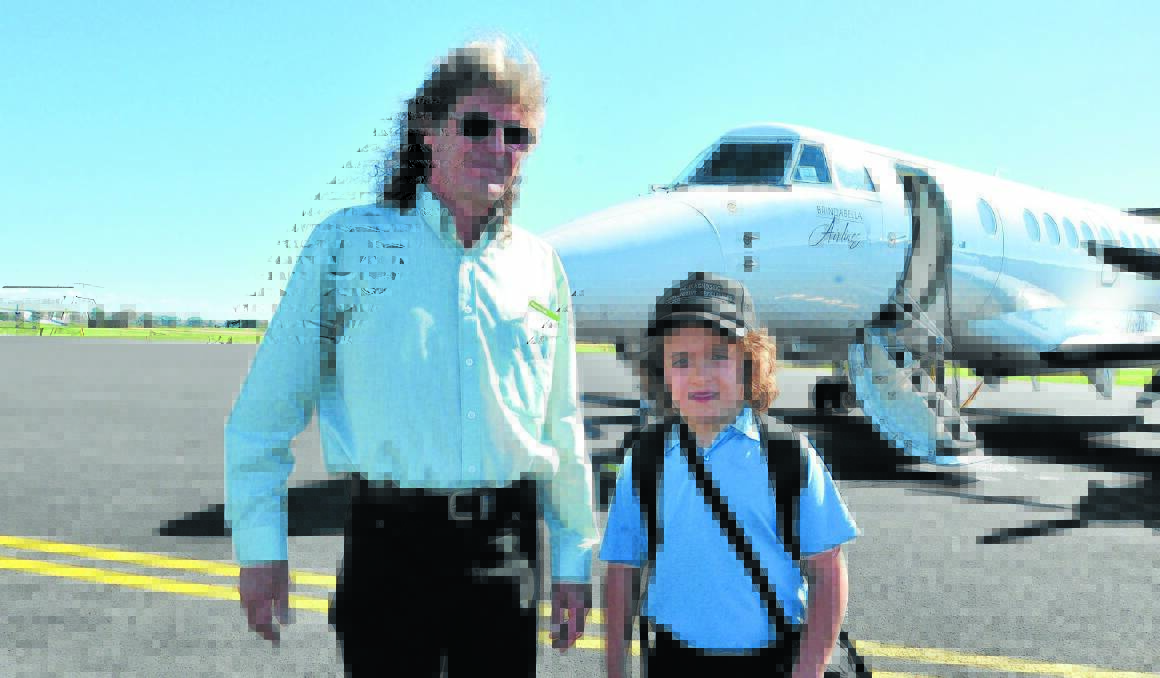FLIGHT PATH: Graeme and Albert Steedman were among the 10 passengers who boarded Brindabella’s first flight out of Orange.  Photo: JUDE KEOGH 0218brindabella4