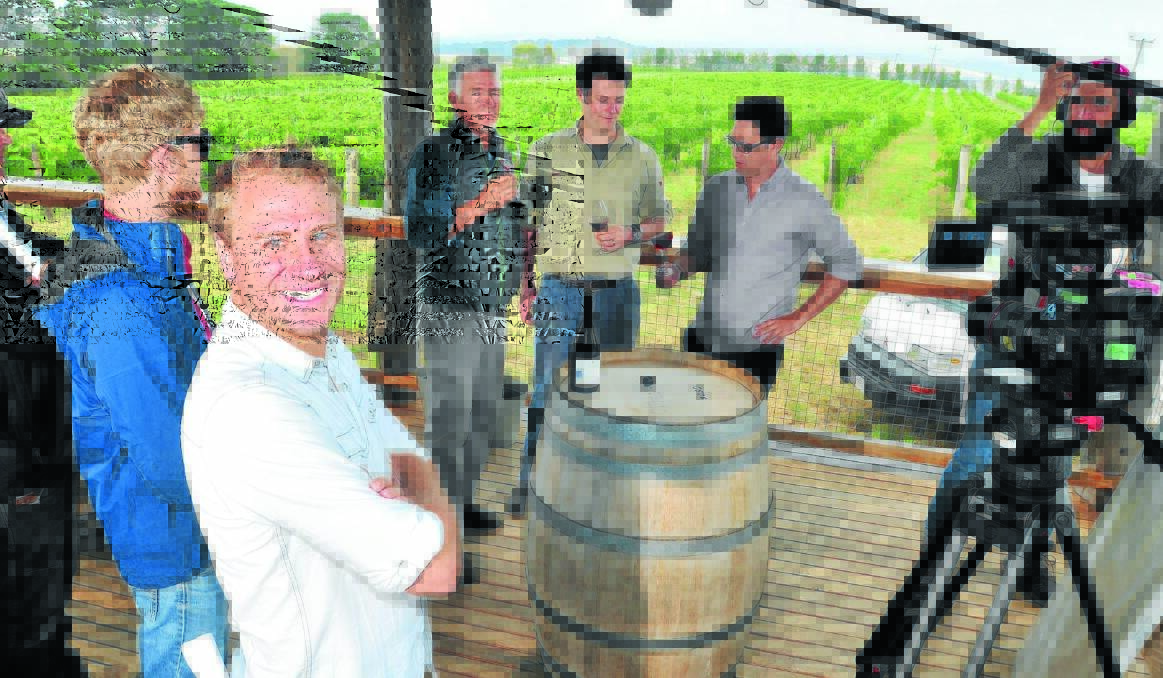 ON LOCATION: Clapper board operator Luke Symes, director/producer Nathan Earl, De Salis owner Charlie Svenson, winemaker Will Rikard-Bell, actor/comedian Chris Taylor and sound recordist Pinky Sener shoot part of the online series PLONK at De Salis Wines yesterday. Photo: JUDE KEOGH 0110film2