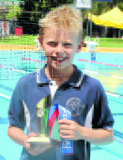 WINNERS ARE GRINNERS: St Mary's Catholic Primary School's Rory Thornhill shows off his winnings from the Diocesan swimming carnival.