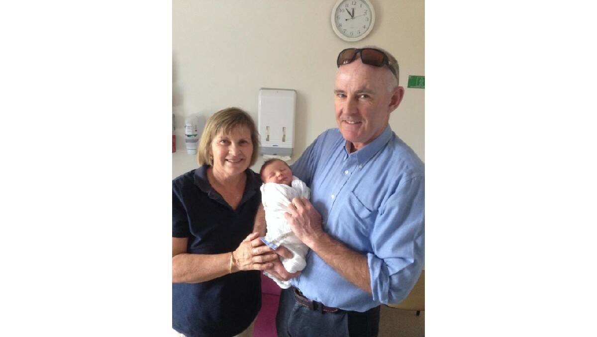 WHATS IN A NAME: Ann and Bill Kelly with the newest addition to the Kelly family, their grandson Patrick. Photo: CONTRIBUTED