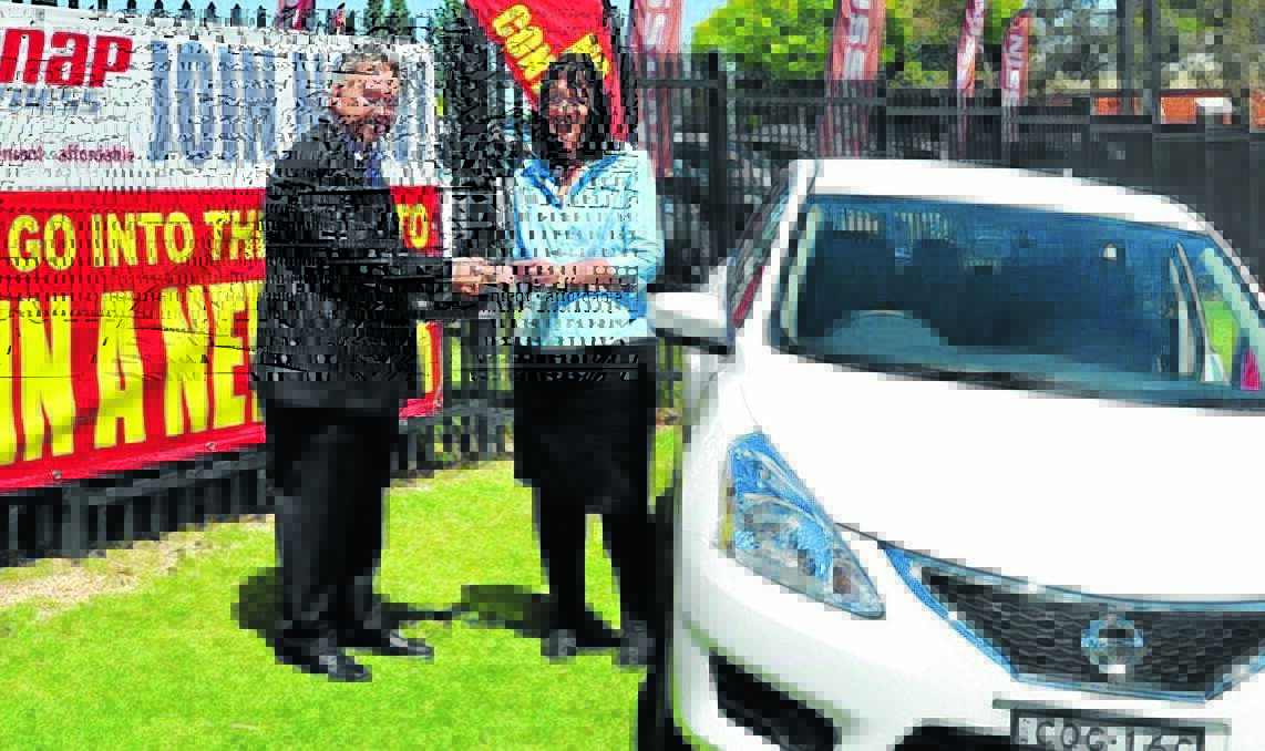 SNAP TO IT: Tony Mackey and Dianne Hazzard with the new Nissan Pulsar Dianne won by joining SNAP Fitness in Orange. 